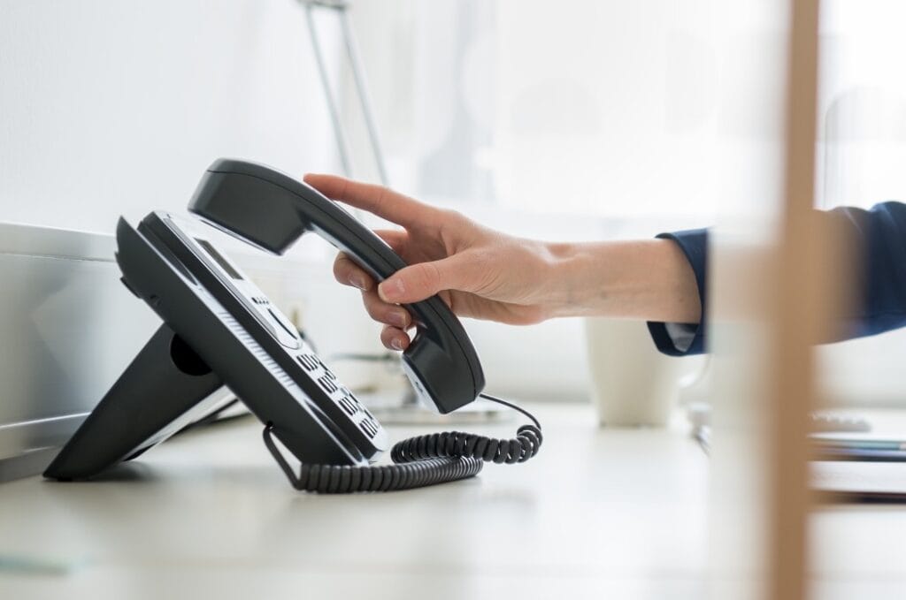 Businesswoman or picking or hanging up  handset